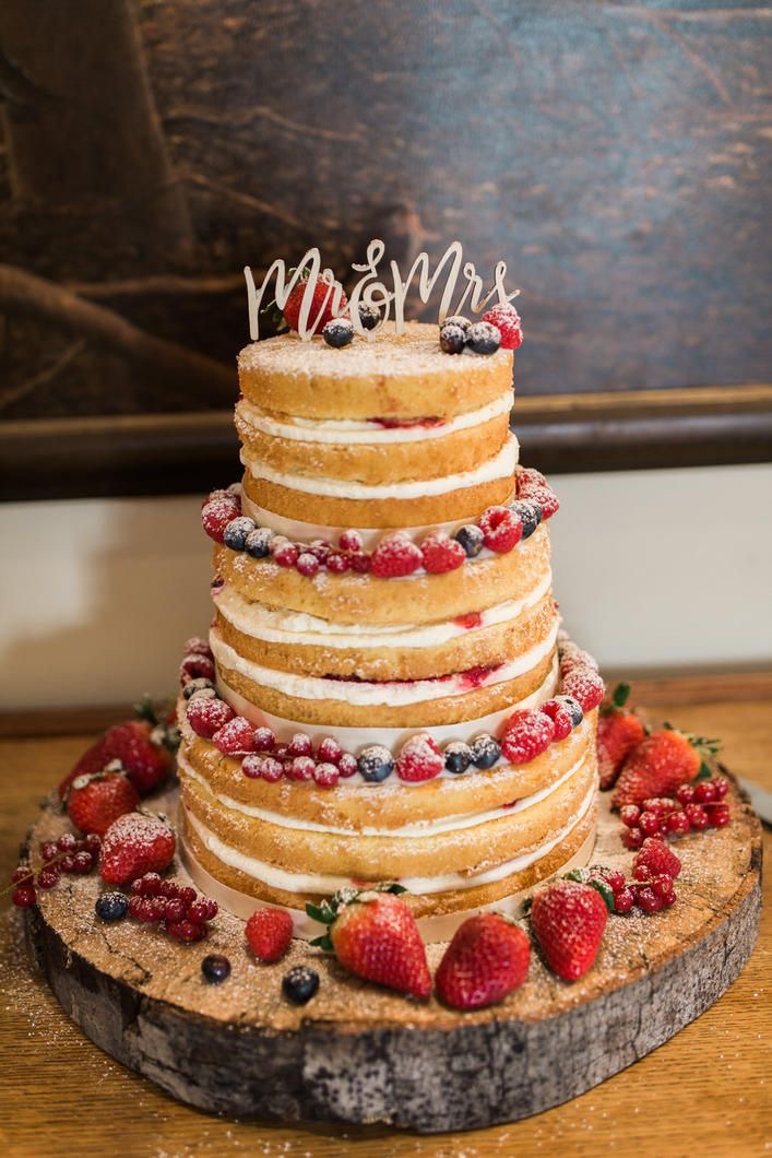 Rustic naked wedding cake with Mr and Mrs cake toppers