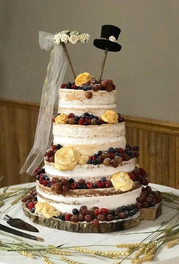 A fruit cake with a symbolic cake topper of the bride and groom