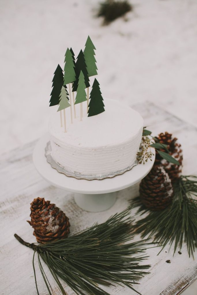 Cute paper tree cut-outs of pine trees as cake toppers