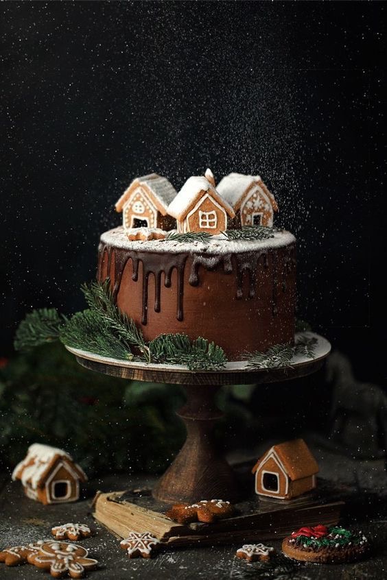 chocolate cake with gingerbread houses as caketopper